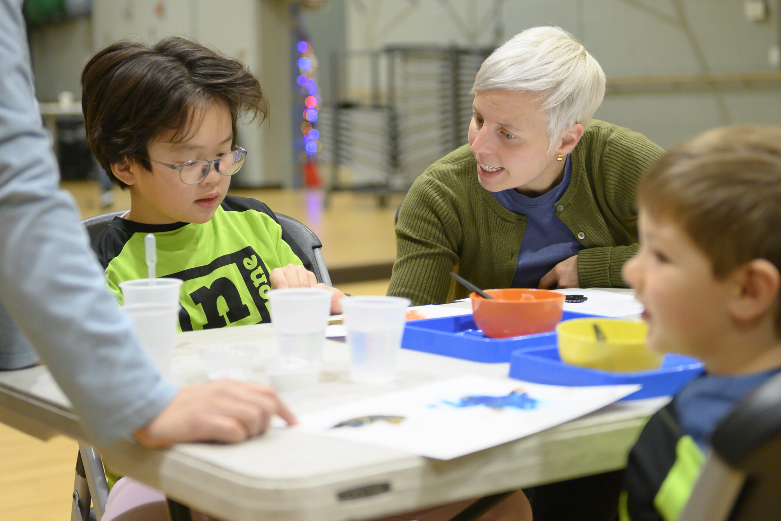 student and instructor working on a project